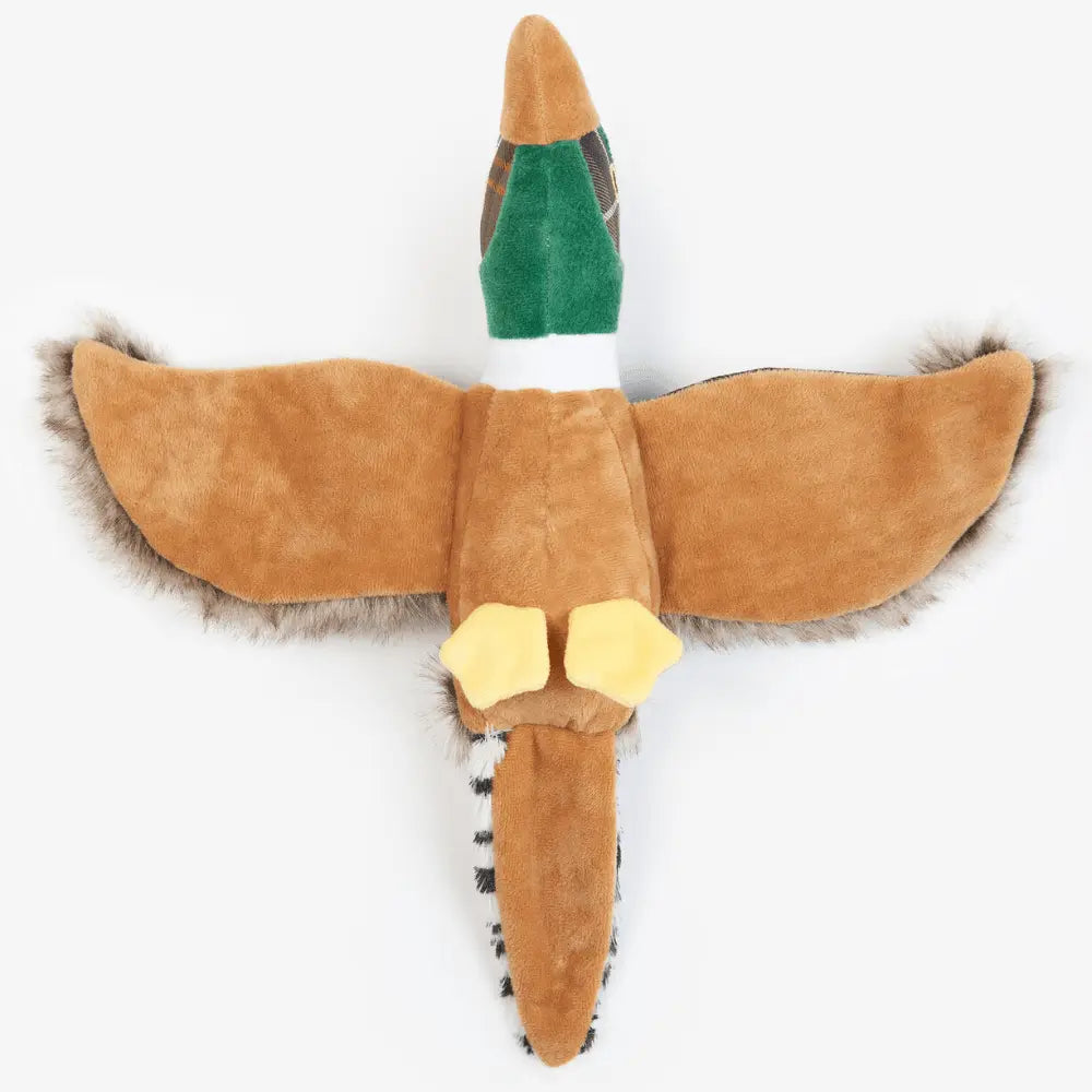 Dessous du jouet faisan Barbour en peluche camel, ailes déployées et pattes jaunes