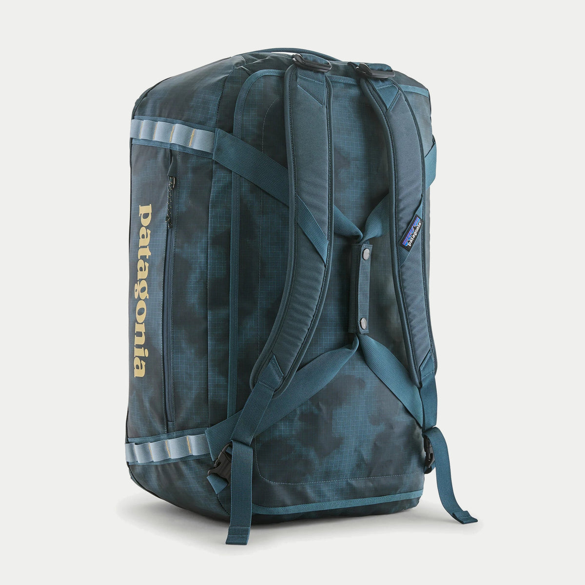 Dos du sac Black Hole Duffel 55L Summit Blue Patagonia debout : harnais de bretelles amovibles et sangles daisy chain