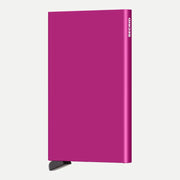 Porte-cartes aluminium rose fuchsia vif de face, petit levier noir sous le boîtier