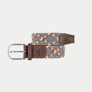 Ceinture tressée BillyBelt Atacama enroulée, tresse grise mêlée de beige et d’orange, embouts en cuir brun et boucle argentée.