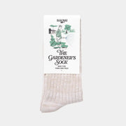 Chaussette du Jardinier beige chinée sous son carton illustré The Gardener's Sock, Built for Farm and Field