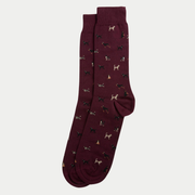 Chaussettes bordeaux chiné superposées et posées à plat, semées de petits chiens noirs, crème et fauve