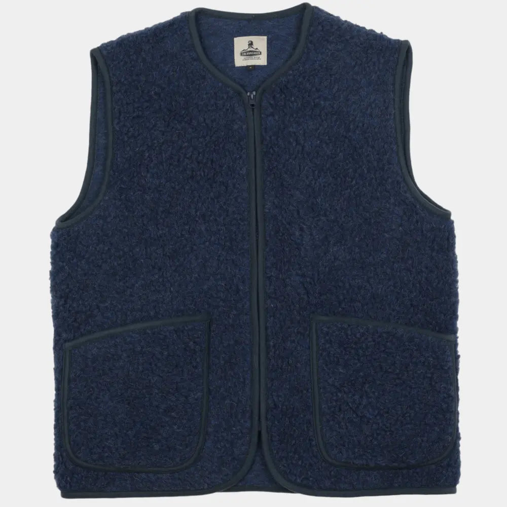 Gilet sans manches en laine bouclée bleu marine, zip central et deux poches plaquées bordées, vu de face