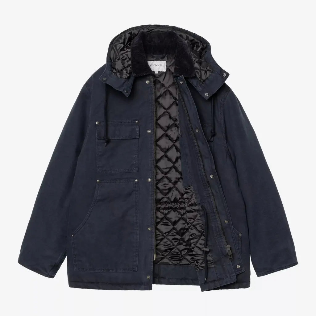 Intérieur du manteau Ambel, doublure matelassée à losanges noirs brillants et cordon de serrage à la taille