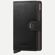 Petit portefeuille en cuir noir fermé, boîtier brun et surpiqûres brunes contrastantes