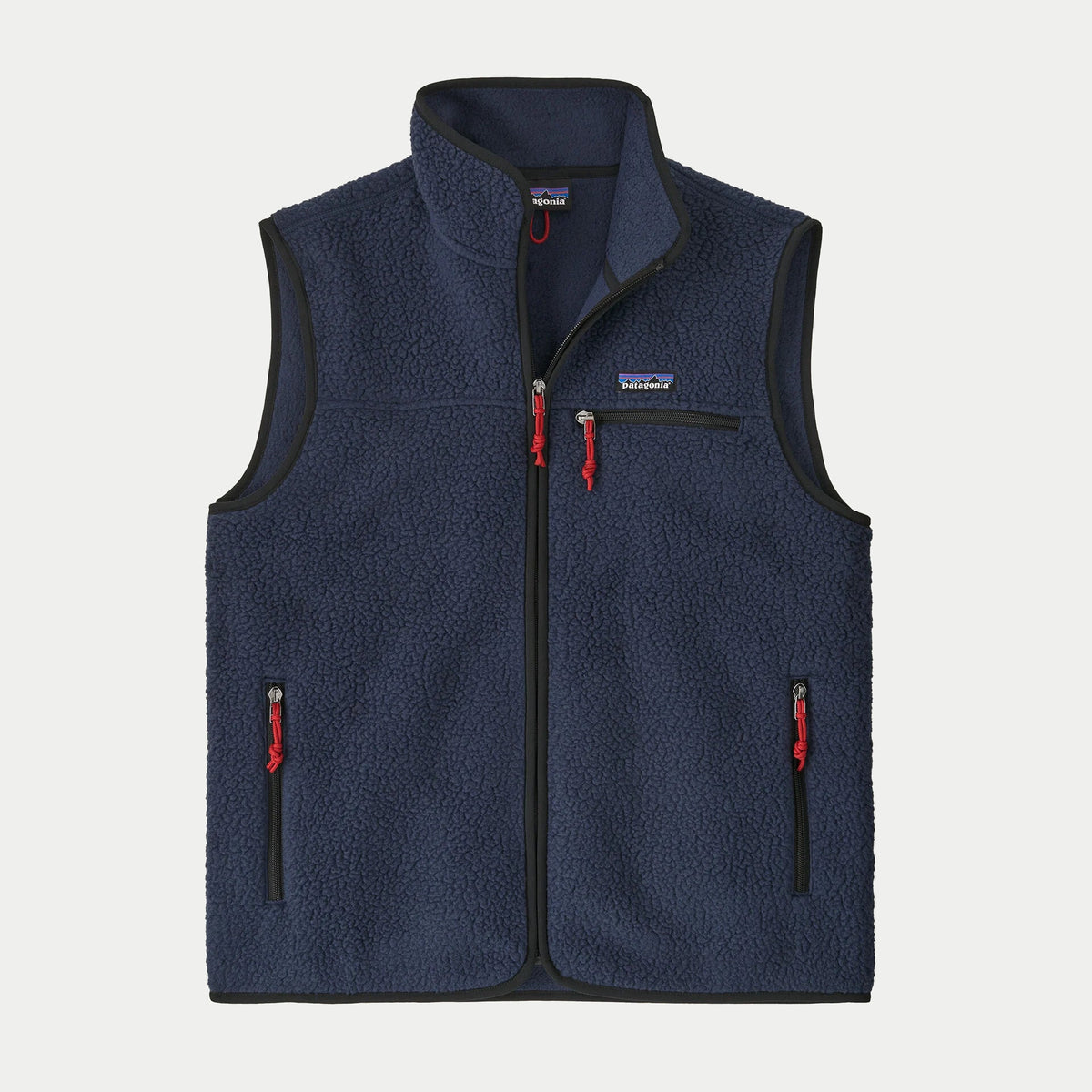 Gilet polaire Retro Pile New Navy Patagonia à plat de face, sherpa bleu marine bordé de noir, tirettes rouges