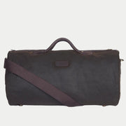 Sac Holdall Wax olive de face, anses cuir, bandoulière sangle et patch cuir de marque