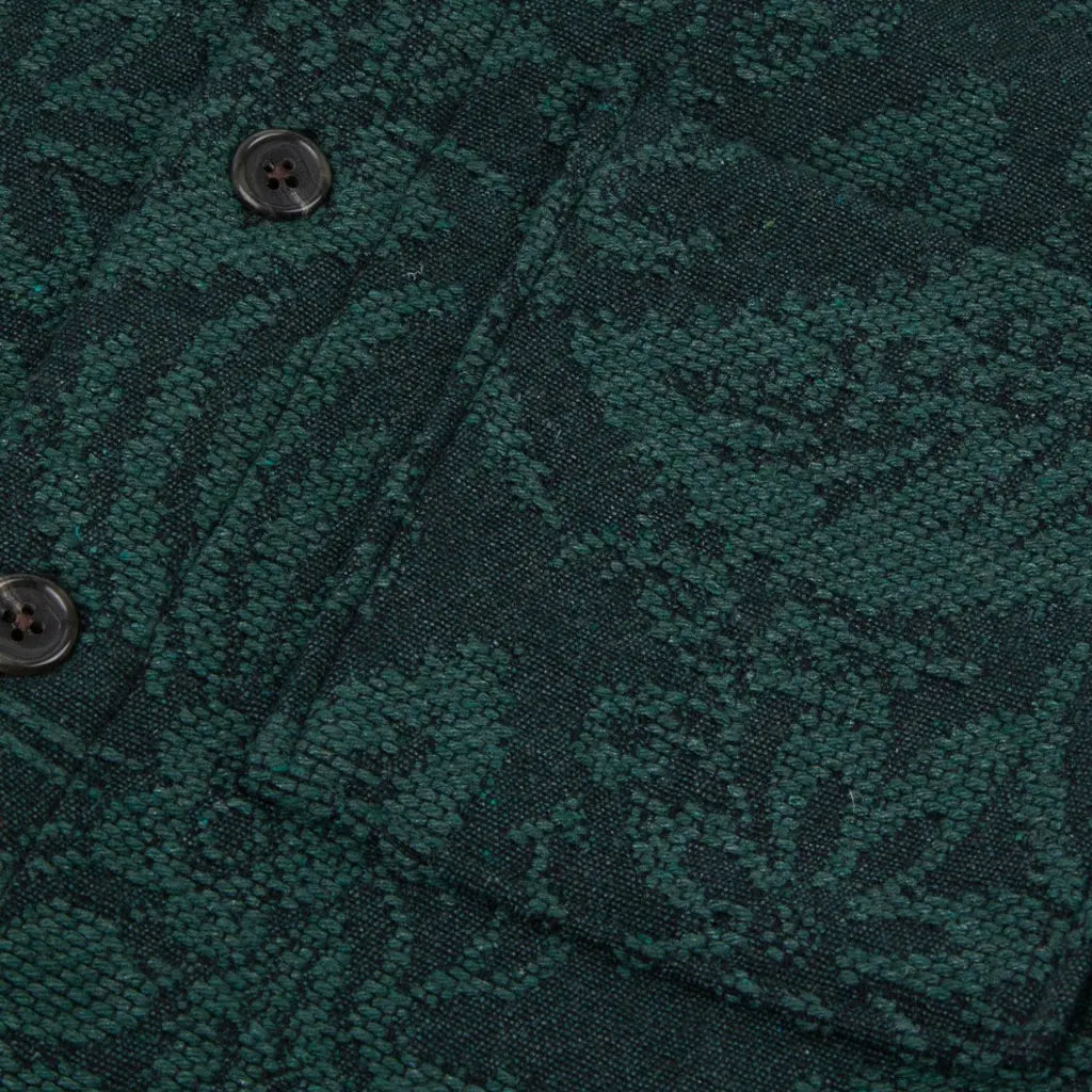 Macro du tissage jacquard vert de la Gastine et de ses boutons foncés à quatre trous