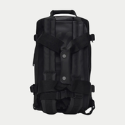 Dos du Texel Duffel Bag Mini noir, bretelles de portage dorsal et pattes pressionnées