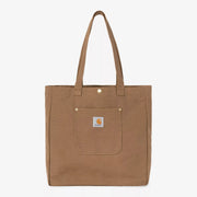 Tote Bag Bay Hamilton Brown vu de face : toile duck brun caramel, poche plaquée à rivets laiton, anses longues