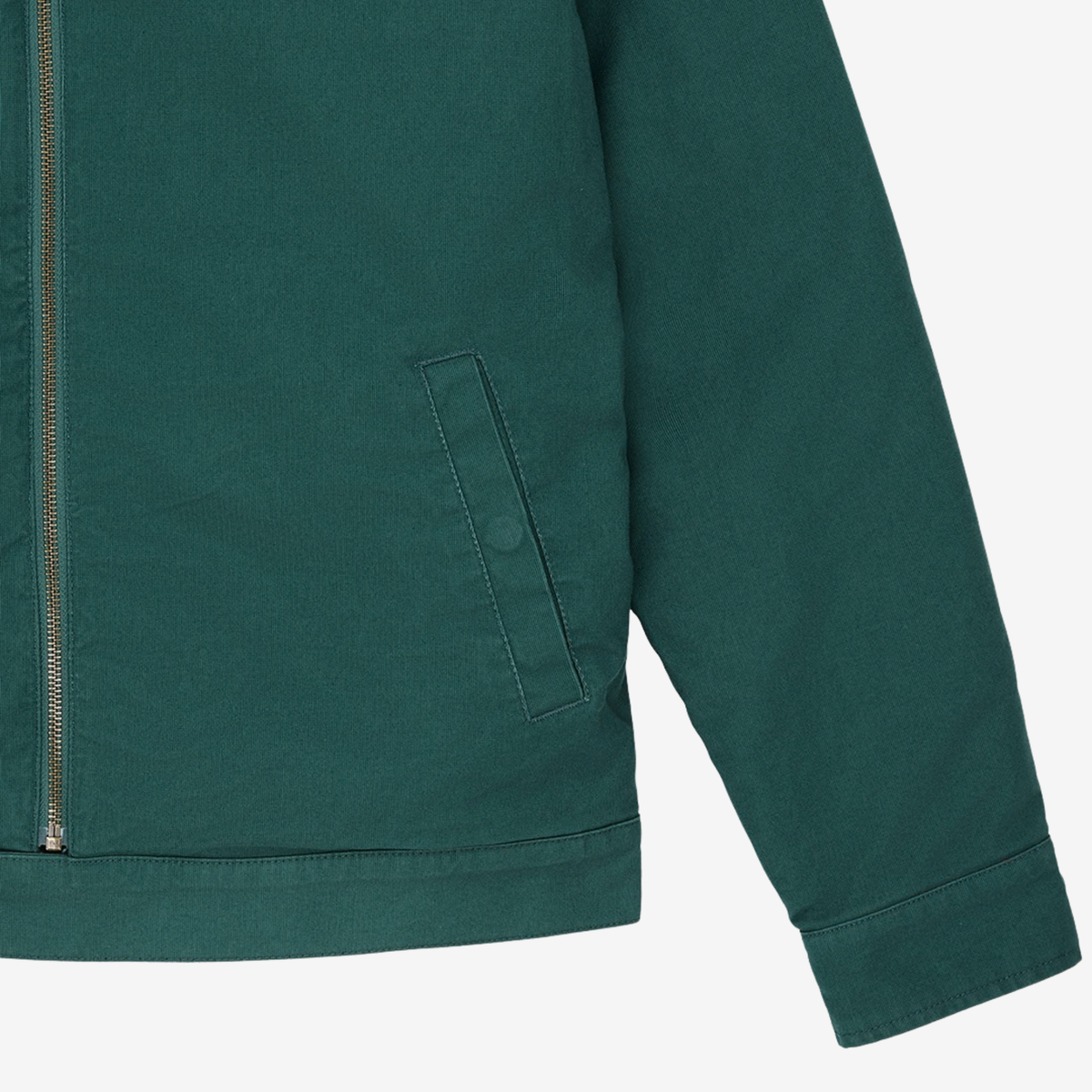 Détail de la Veste Cutaway Racing Green Deus Ex Machina : poche basse passepoilée à pression, ourlet et poignet