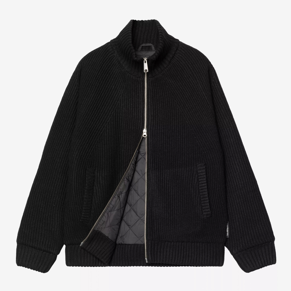 Veste Banley noire Carhartt WIP entrouverte : doublure matelassée en taffetas noir visible sous la maille